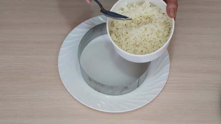 To make a salad with avocado and salmon, cook rice