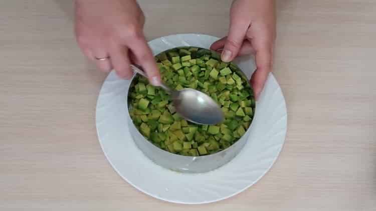 Lay out the ingredients for the salad with avocado and salmon.