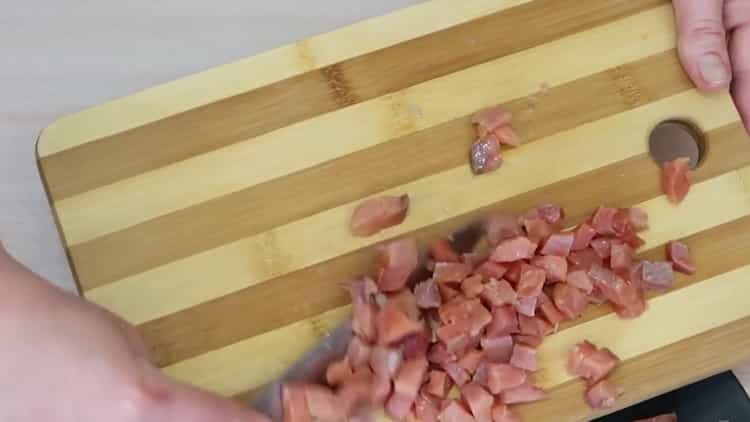 To make avocado and salmon salad, cut the fish