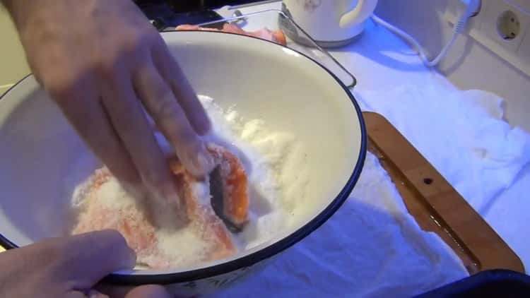 To cook salted fish, dip the fish