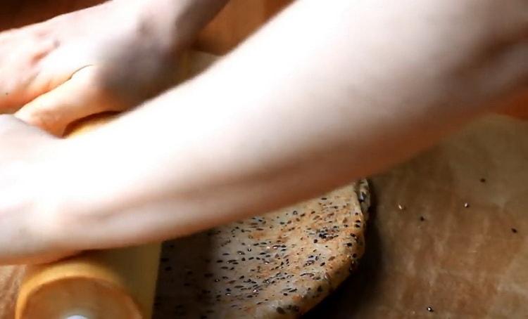 Roll out the dough to make salt cookies.