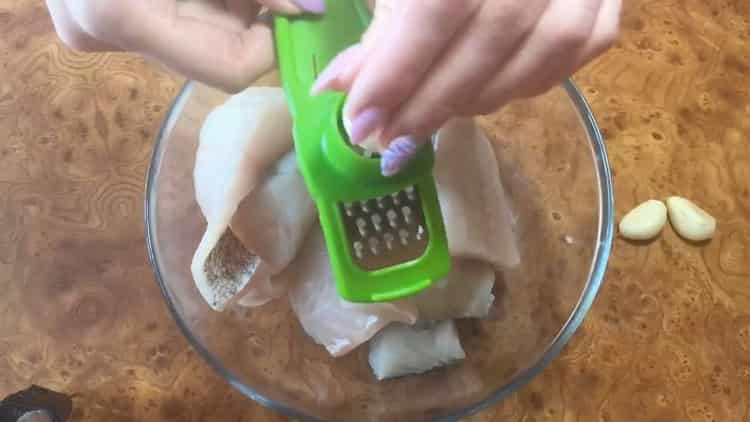 According to the recipe for cooking pike perch in the oven, rub garlic