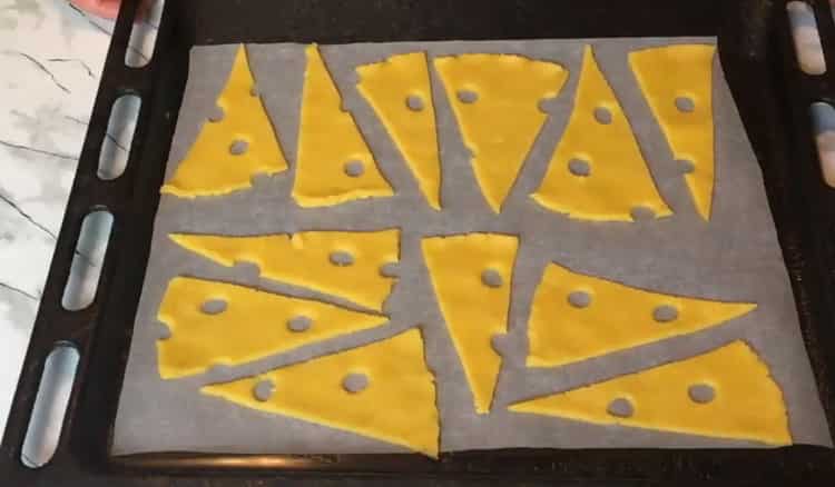 To make cheese biscuits, preheat the oven