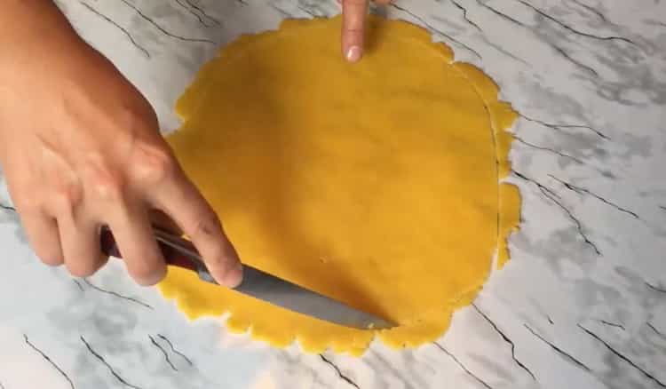 To make cheese biscuits, roll out the dough