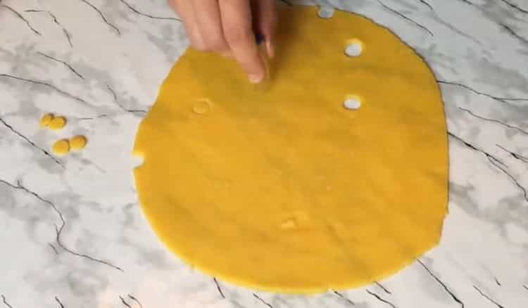 To make cheese biscuits, make holes in the dough