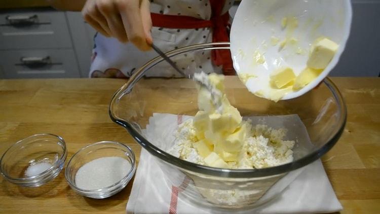 To make envelope curd cookies, mix flour with butter