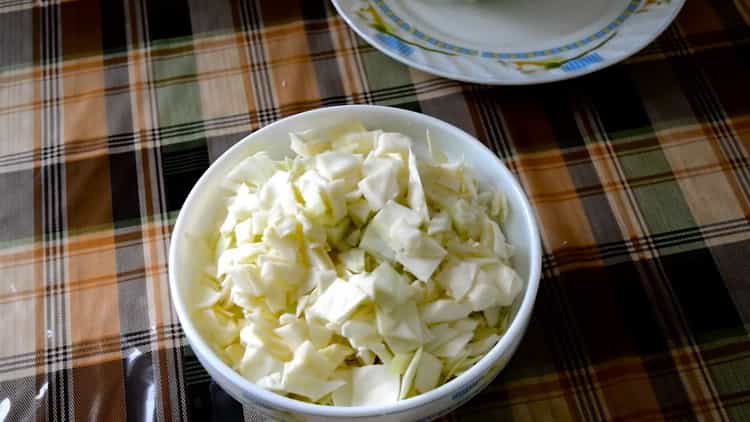To cook stewed cabbage with potatoes, chop all the ingredients