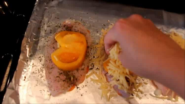 To cook fish in the oven, put cheese on the fish