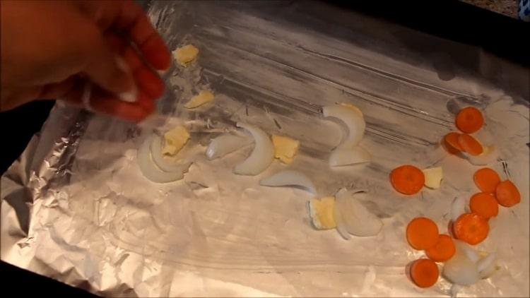 To cook fish in the oven, put the vegetables on the foil