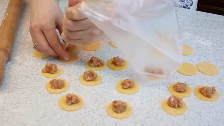 To prepare colored dumplings, put the minced meat on the dough