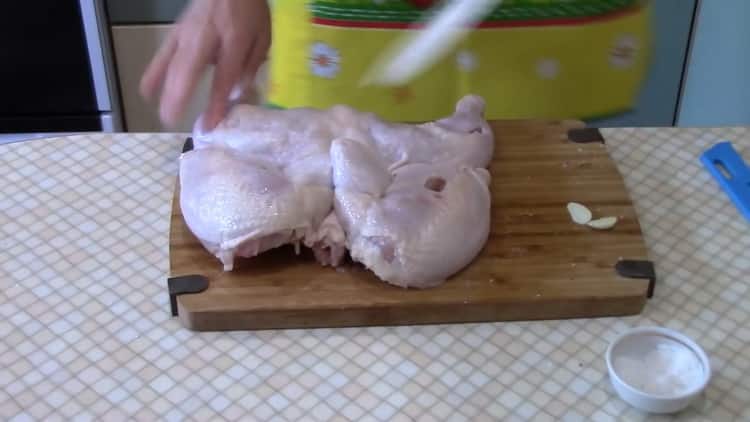To cook chicken tobacco in the oven according to a simple recipe. peel the garlic