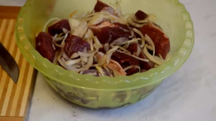 To cook beef skewers, chop onions