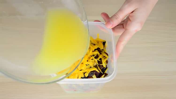 Mix the ingredients for a Christmas cake.