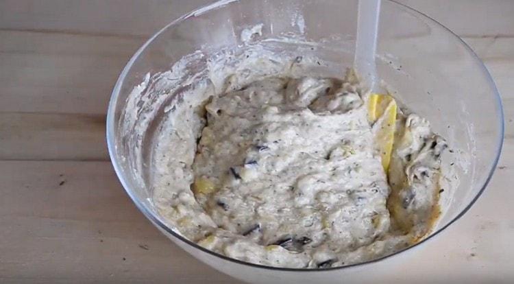 Mix the dough so that the nuts and chocolate are evenly distributed on it.