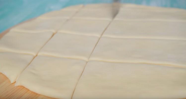 Cut the dough into squares.