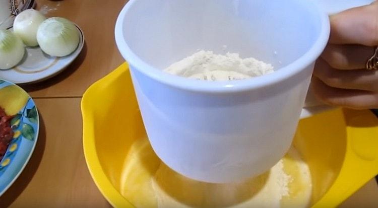 Sift flour to the liquid components.