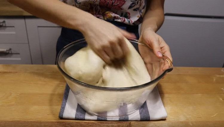 We crush the approached dough.