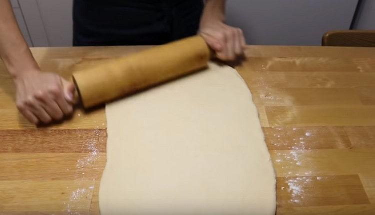 Roll out the dough with a rolling pin.