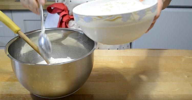 Add the flour in portions.