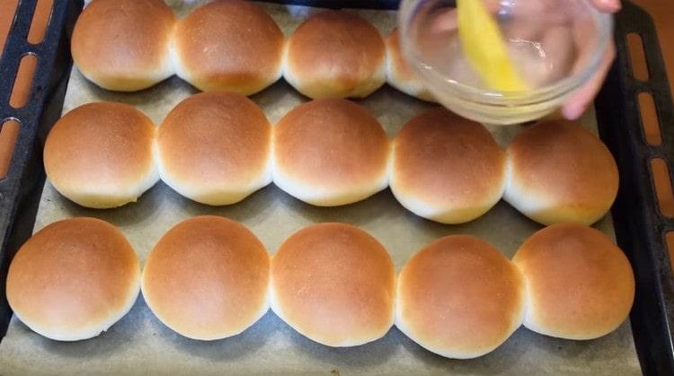 We grease the hot buns with the resulting syrup.