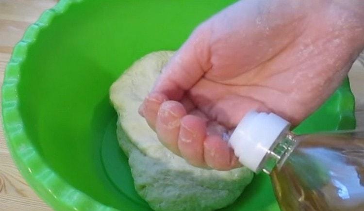 Add vegetable oil to the dough.