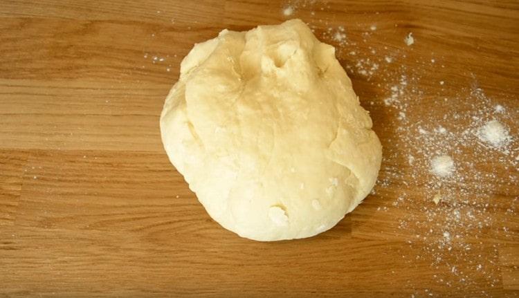Knead the dough again and transfer to the work surface.