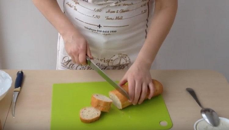 Cut the baguette into slices.
