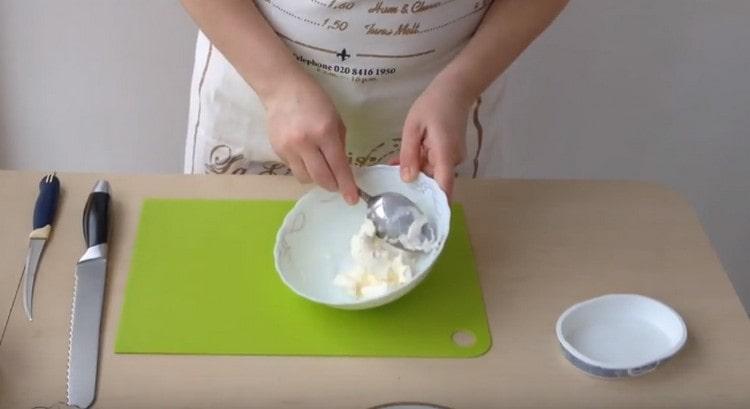 Mash Philadelphia cheese with a spoon or fork.