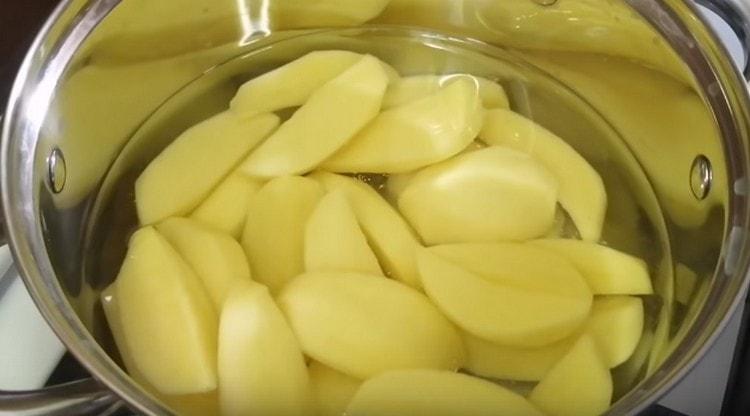 Boil the potatoes until tender.