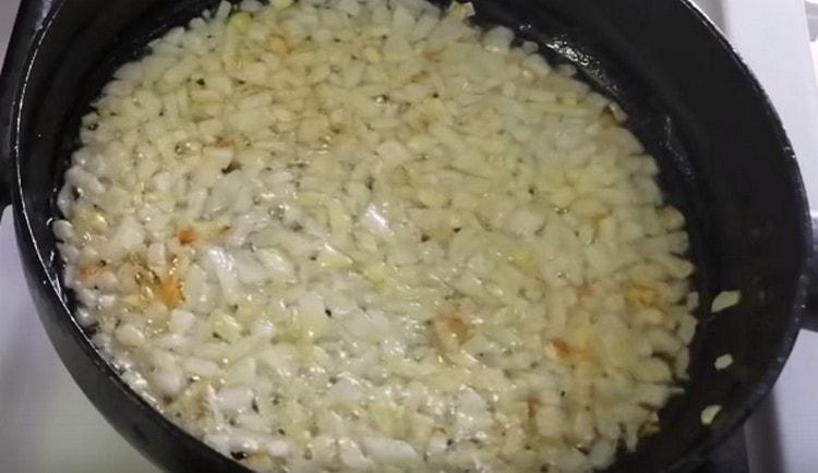 In a pan, fry the onions until golden brown.