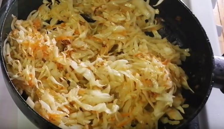 Add sauerkraut to the onion and fry for a few more minutes.
