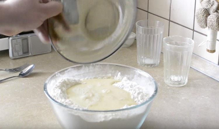 Add the egg mixture to the flour.