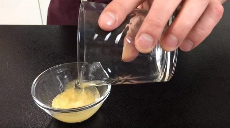 Fill gelatin with water.