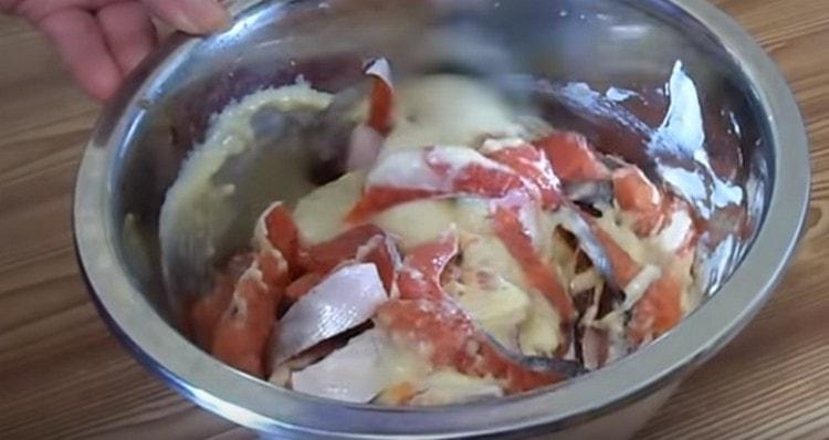 Pour batter into a bowl of fish and mix.