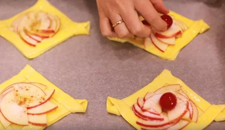 On the center of the workpieces spread on the cherry.