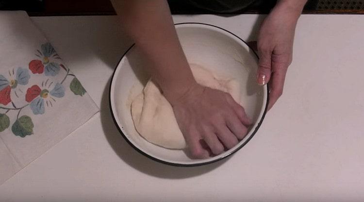 After a while, knead the dough again a little.