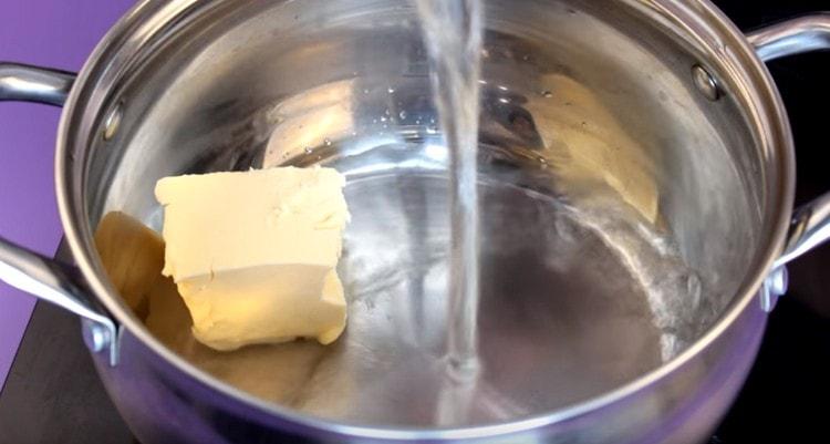 Pour water into the stewpan, add the butter and salt.