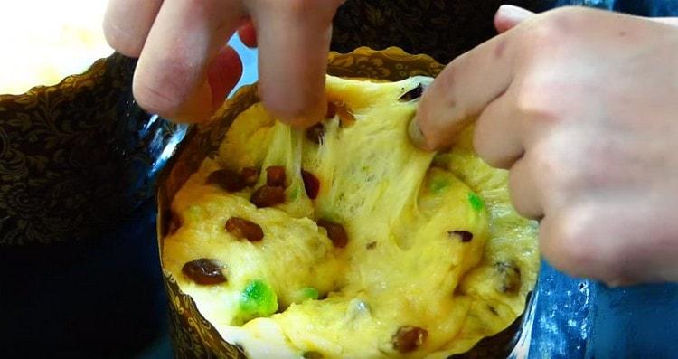 Having made a cross-shaped incision on the dough, we turn it to the sides.