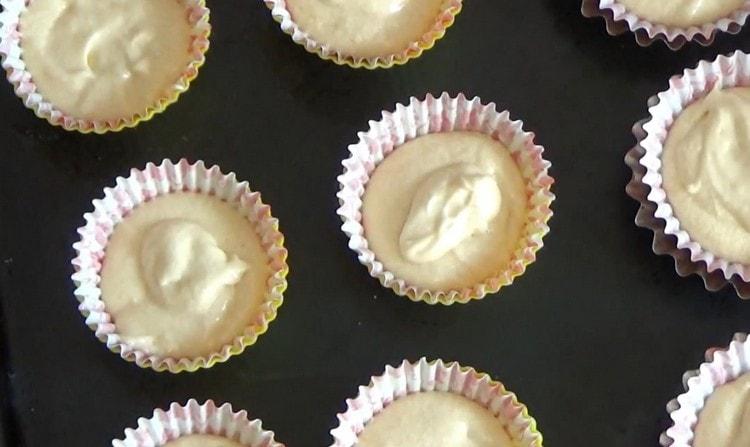 Put the molds on a baking sheet and send to the oven.