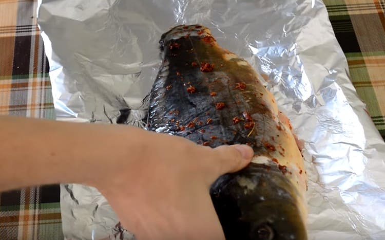 We spread the carp on a large sheet of foil.