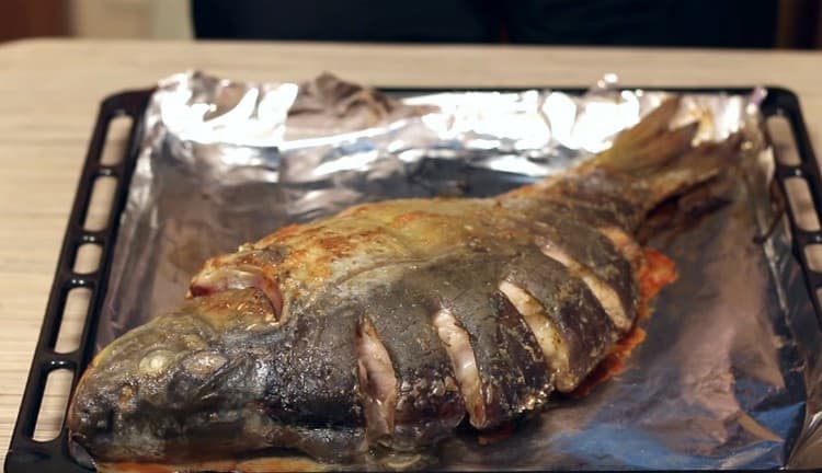 Bake the fish until cooked.