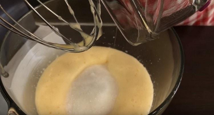 Add sugar to the eggs and beat again.