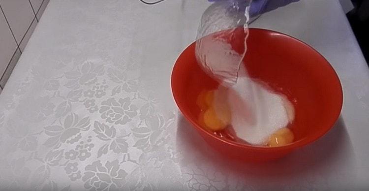 Add sugar to the eggs.