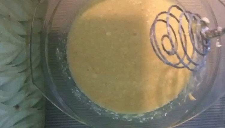 Add softened margarine to the eggs and beat again.