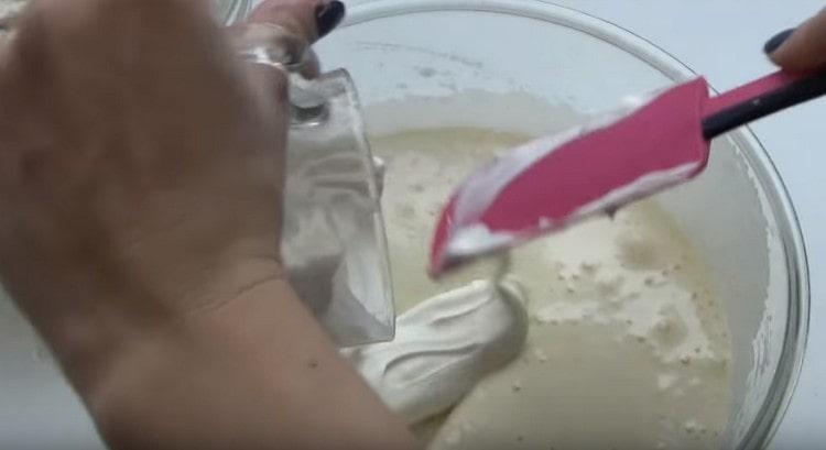 Add sour cream and vanilla sugar to the egg mass.