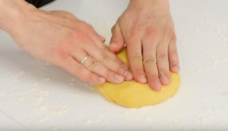Knead the dough slightly.