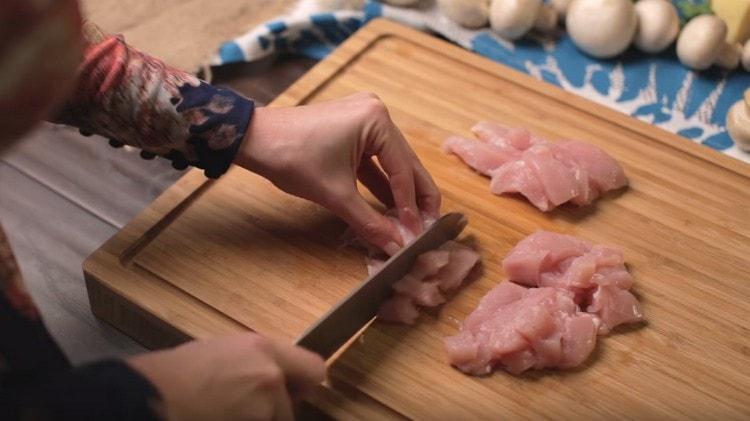 Chop the chicken breast into pieces.
