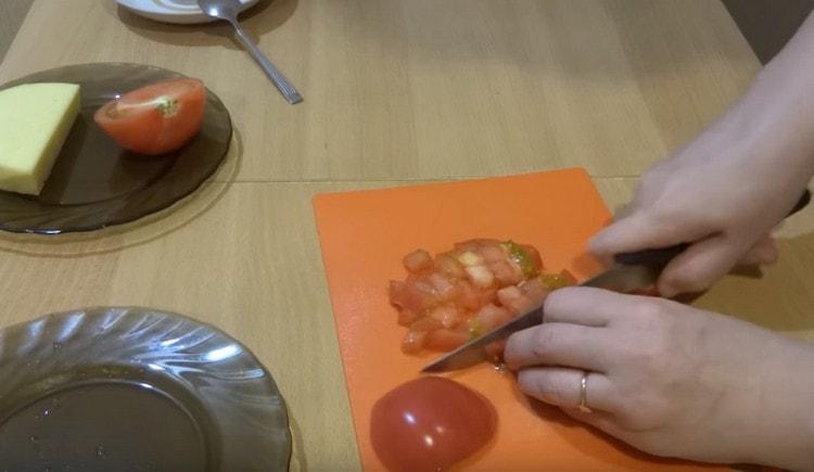 Dice a fresh tomato.