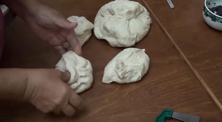 Dividing the dough in half, divide each part by another 3.