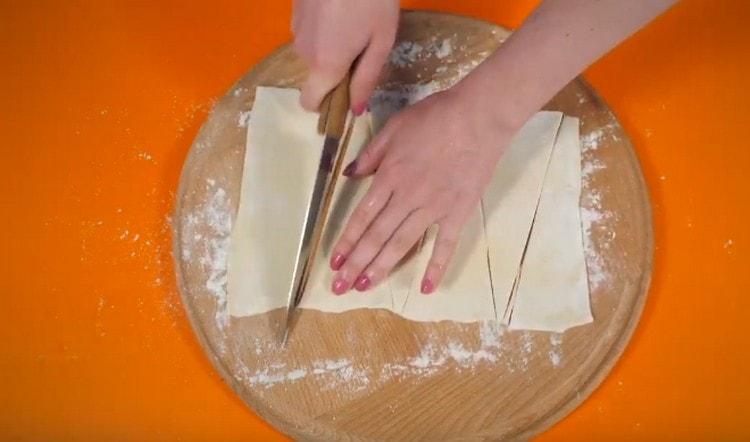 Cut the dough into triangles.